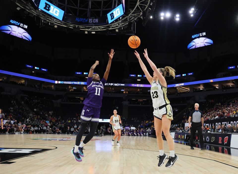 Hailey Weaver #11 of the Northwestern Wildcats attempts to block the shot of Abbey Ellis #23 of the Purdue Boilermakers in the First Round of the Big Ten Tournament at Target Center on March 06, 2024 in Minneapolis, Minnesota.