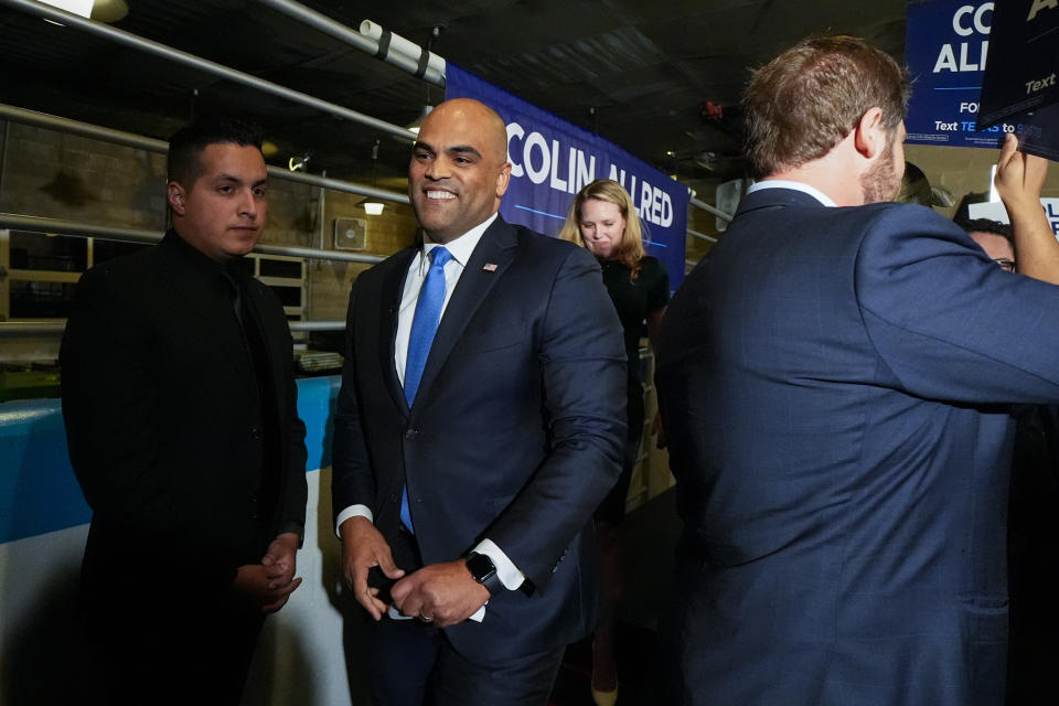 U.S. Senate hopeful Colin Allred, D-Texas, center, and his wife Aly Eber, leave the stage after addressing supporters during an election night gathering, Tuesday, March 5, 2024, in Dallas. (AP Photo/Julio Cortez)