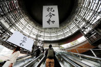 A huge banner and screen celebrating Reiwa, Japan's new imperial era, are displayed on the first day of the Emperor Naruhito’s accession to the throne at a business district in Tokyo, Japan May 1, 2019. REUTERS/Issei Kato