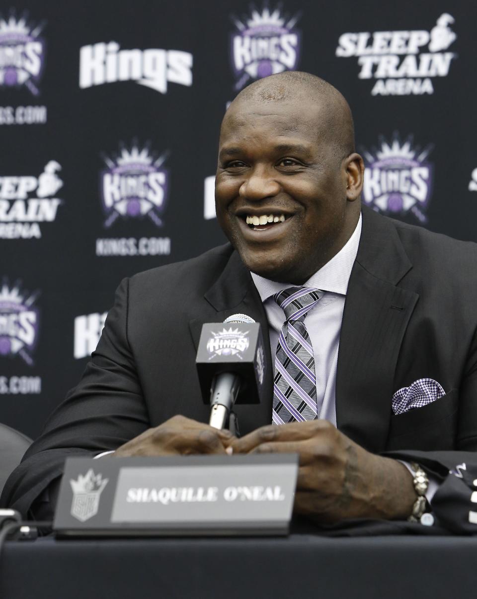 FILE - In this Sept. 24, 2013 file photo, Shaquille O'Neal smiles during a news conference where he was welcomed as one of the new minority owners of the Sacramento Kings in Sacramento, Calif. O'Neal said in an interview on Monday, March 3, 2014, that he's seeking redemption for "Shaq Fu," his infamous 2-D brawler originally released in 1994 that's now considered to be among the worst games ever made. The four-time NBA champion is launching a crowdfunding campaign to create a "Shaq Fu" follow-up called "Shaq Fu: A Legend Reborn." (AP Photo/Rich Pedroncelli, file)