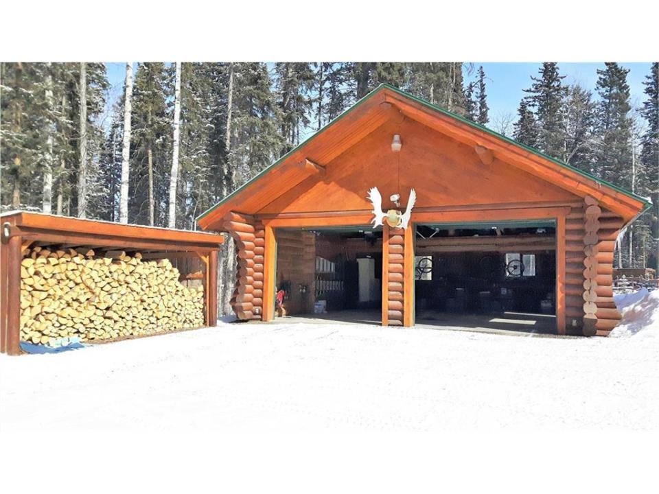 <p><span>7 5241 Township Road, Rural Mountain View County, Alta.</span><br>Car enthusiasts will love the double detached garage, double carport and 48’ by 40’ workshop with in-floor heating and a 12-foot door.<br>(Photo: Zoocasa) </p>