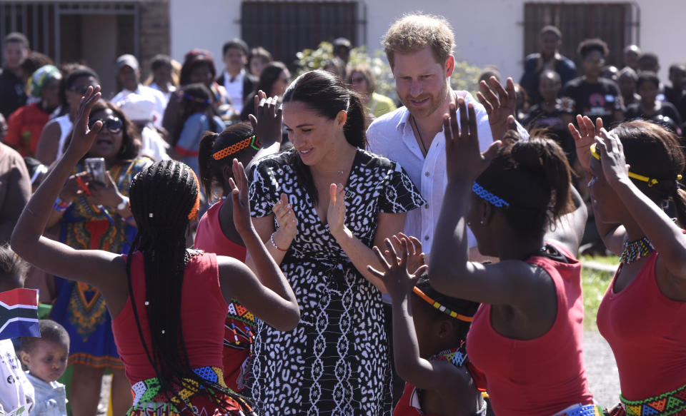 CAPE TOWN, SOUTH AFRICA - SEPTEMBER 23: The Duke and Duchess of Sussex, Prince Harry and his wife Meghan interact with children during The Duke and Duchess of Sussex visit to Nyanga Township on September 23, 2019 in Cape Town, South Africa. Their Royal Highnesses made their first visit in South Africa, to a Justice Desk initiative in Nyanga township, which teaches children about their rights, self-awareness and safety, and provides self-defence classes and female empowerment training to young girls in the community. (Photo by Brenton Geach/Gallo Images via Getty Images)