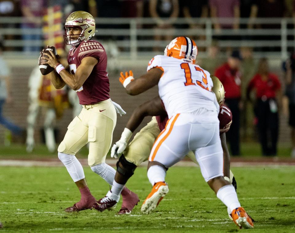 Florida State Seminoles quarterback Jordan Travis (13) looks for a teammate ready for a pass. The Clemson Tigers lead the Florida State Seminoles 24-14 at the half during an ACC game at Doak Campbell Stadium on Saturday, Oct. 15, 2022.