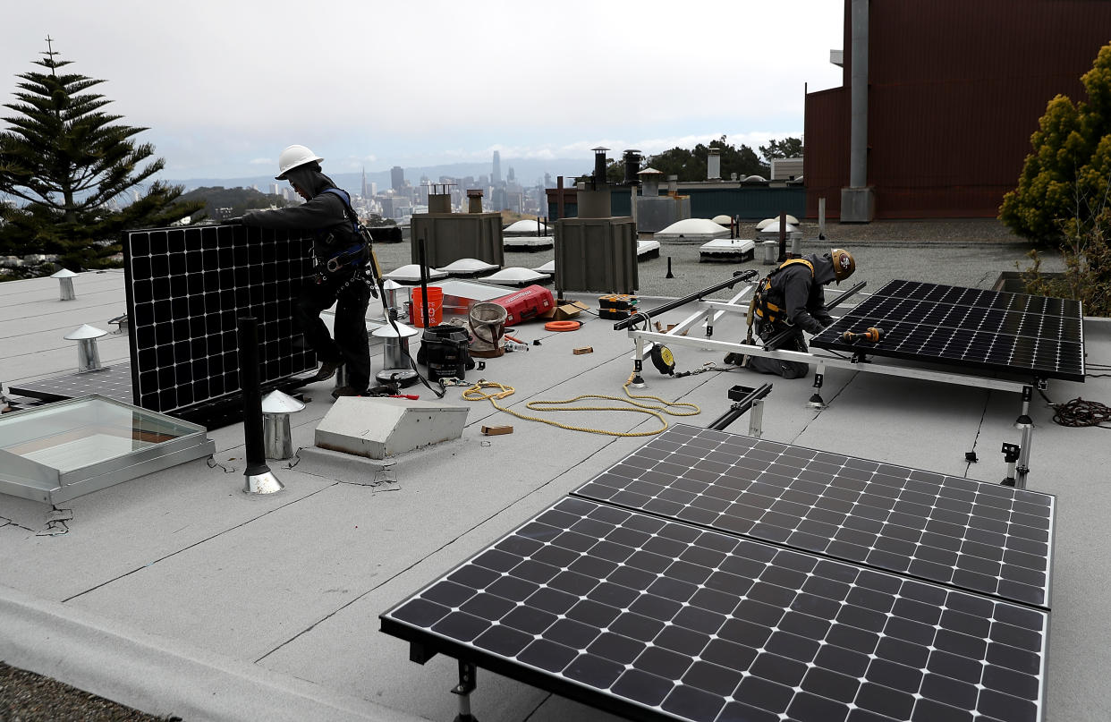 Solar panels are installed on the roof of a home in San Francisco.