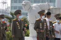 Korean People's Army officers visit the Fatherland Liberation War Martyrs Cemetery in Pyongyang, North Korea, Tuesday, July 27, 2021 to mark the Korean War armistice anniversary. The leaders of North and South Korea restored suspended communication channels between them and agreed to improve ties, both governments said Tuesday, amid a 2 ½ year-stalemate in U.S.-led diplomacy aimed at stripping North Korea of its nuclear weapons. (AP Photo/Cha Song Ho)