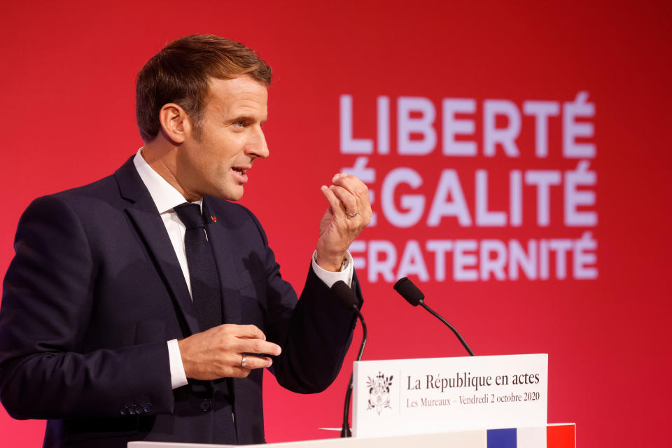 French President Emmanuel Macron delivers a speech to present his strategy to fight separatism, Friday Oct. 2, 2020 in Les Mureaux, outside Paris. President Emmanuel Macron, trying to rid France of what authorities say is a "parallel society" of radical Muslims thriving outside the values of the nation, is laying the groundwork Friday for a proposed law aimed at helping remedy the phenomenon. (Ludovic Marin / POOL via AP)