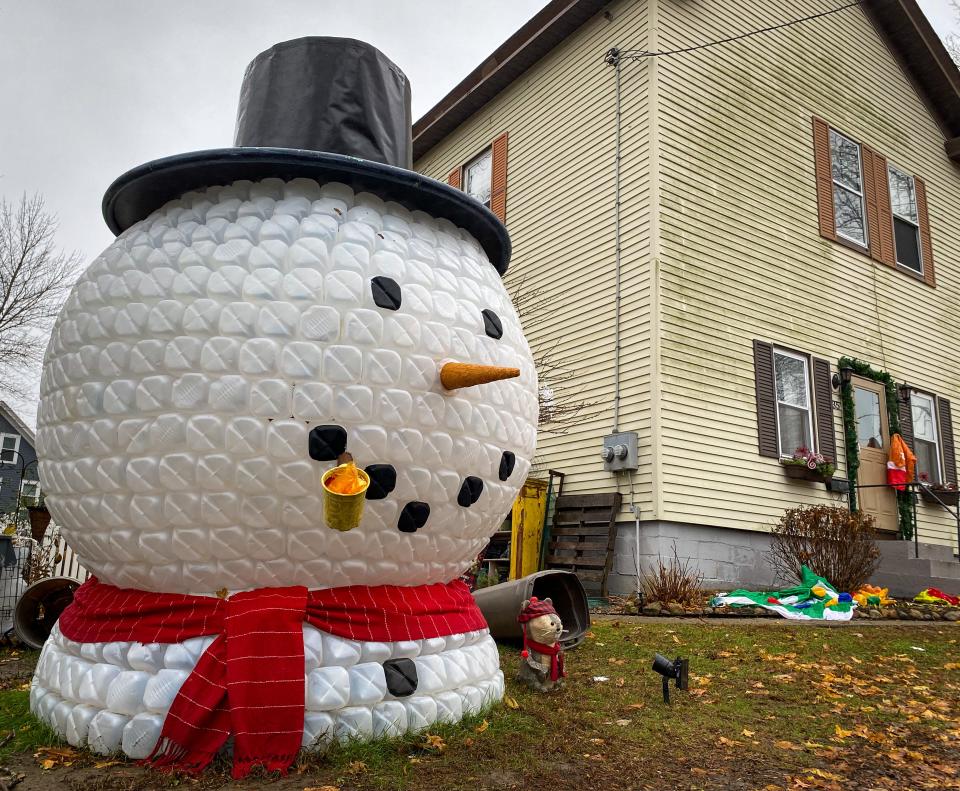 Jughead, a massive 9-foot snowman head made of nearly 800 empty gallon jugs, stands outside the house of Melissa Morgado of Somerset.