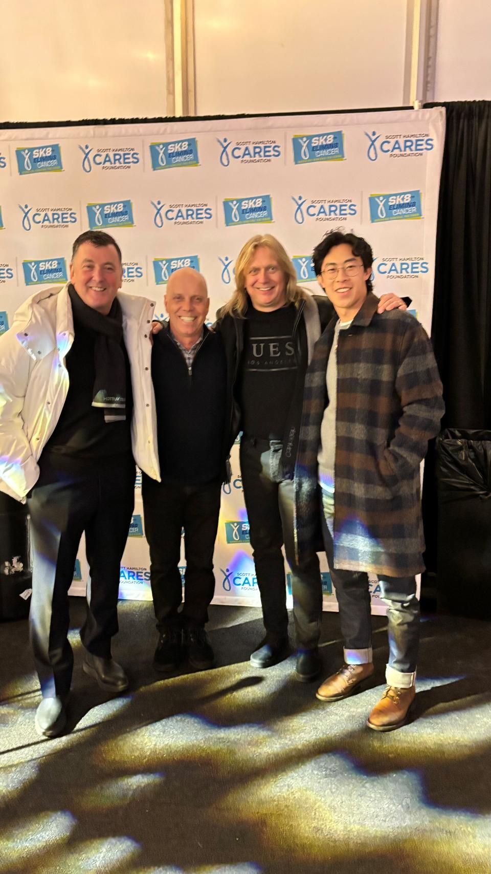 Scott Hamilton, second from left, poses Feb. 16, 2024, in New York with Brian Orser of Canada and Jozef Sabovčík of Slovakia, the two skaters he beat out for a gold medal in the Olympics in figure skating 40 years earlier. Reining Olympic gold medal figure skater Nathan Chen of America is on the right