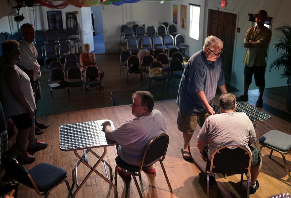 In this June 23, 2013 photo, Thom Hansen, standing, center right, also known as Panzi, directs a rehearsal for a production of "Hello, Cherry Grove!" at the Cherry Grove Community House and Theater in the Fire Island community of Cherry Grove, N.Y. Residents of Cherry Grove are celebrating the addition of the theater to the National Register of Historic Places. The designation announced in June confirms that the facility opened in 1948 is the oldest continuously operating gay and lesbian theater in the United States. Locals note that 20 years before the Stonewall riots in New York City helped launch the gay rights movement, gays and lesbians were freely expressing themselves in Cherry Grove. (AP Photo/Seth Wenig)