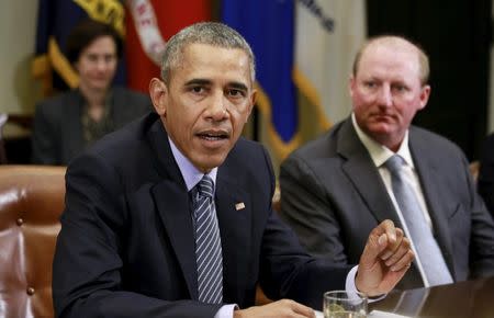 U.S. President Barack Obama hosts a roundtable with CEOs to discuss efforts to tackle climate change both in the United States as well as on a global scale at the White House in Washington, DC, U.S. on October 19, 2015. Seated beside Obama is Berkshire Hathaway Energy CEO Gregory Abel. REUTERS/Kevin Lamarque/File Photo