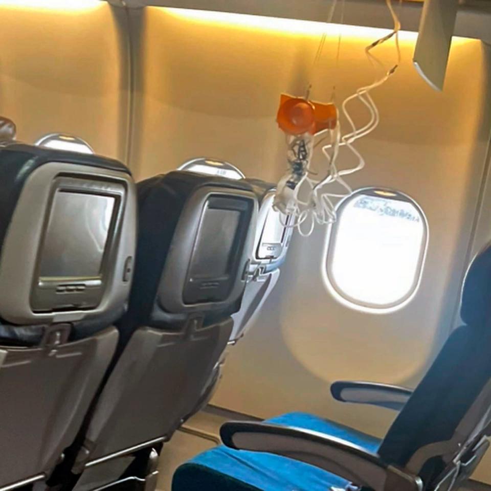 This mobile photo courtesy of passenger Jazmin Bitanga shows the interior of a Hawaiian Airlines plane on its flight from Phoenix to Honolulu, Sunday, 18 December2022 (AP)