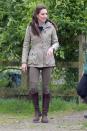 <p>In a navy sweater over a checkered shirt under a beige raincoat with Zara jeans and brown leather boots during a visit to the Farms for City Children charity in Gloucester</p>