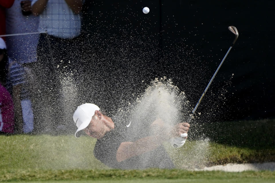 Brooks Koepka hits from a bunker on the 16th hole during the second round of the LIV Golf Team Championship at Trump National Doral Golf Club, Saturday, Oct. 29, 2022, in Doral, Fla. (AP Photo/Lynne Sladky)
