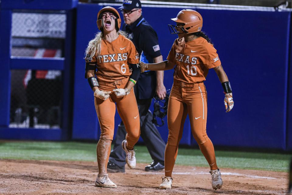 Texas outfielder Bella Dayton (6) screams after scoring a run in a 6-5 win against OSU on Monday night.