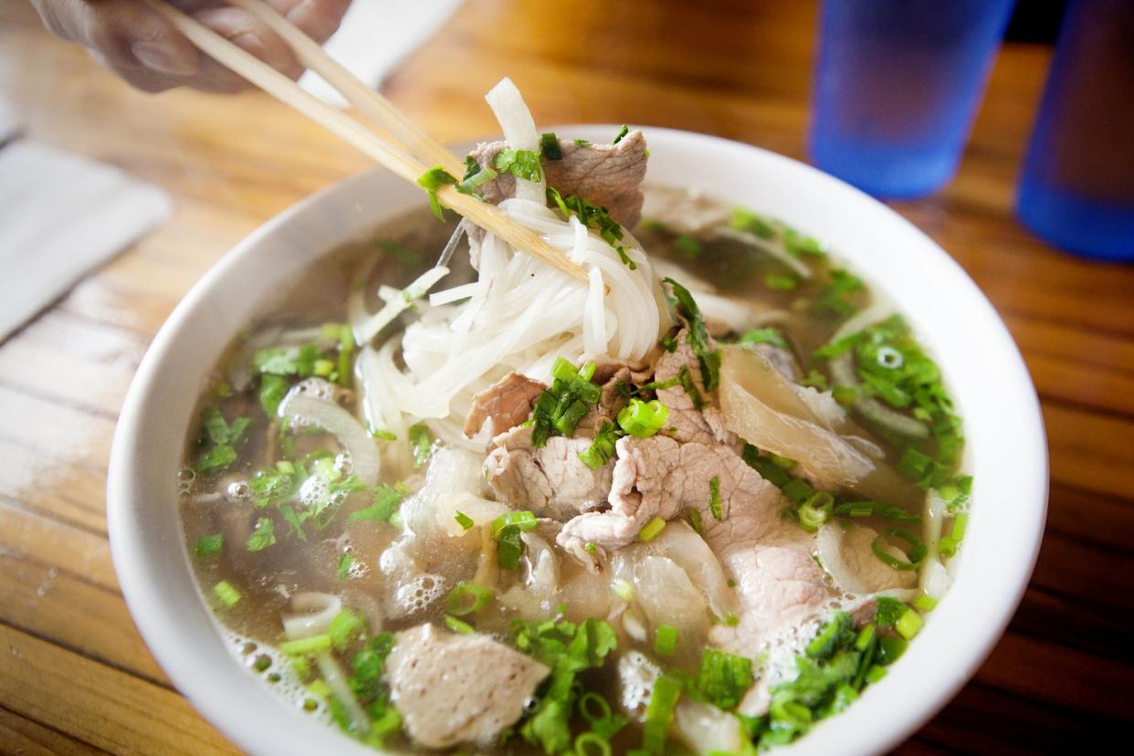 Vietnamese Pho Noodle Soup with variety of meat and vegetables.