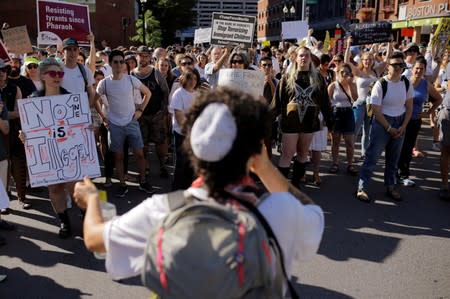 Demonstrators take part in the Never Again Para Nadir protest against ICE Detention camps in Boston