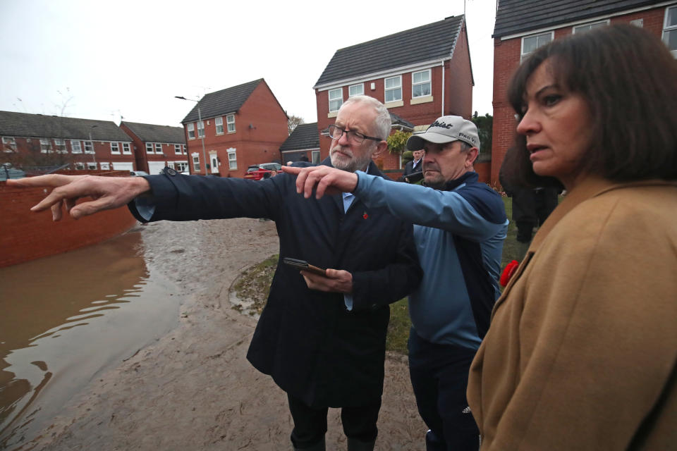 Labour leader Jeremy Corbyn and Labour MP Caroline Flint during a visit to Conisborough, South Yorkshire, where he met residents affected by flooding.