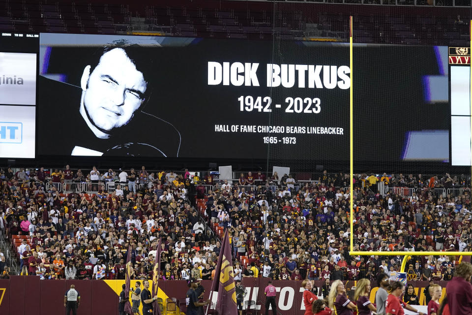Scoreboard displays the image of Hall of Fame Chicago Bears player Dick Butkus during a moment of silence before the start of the first half of an NFL football game between the Washington Commanders and the Chicago Bears, Thursday, Oct. 5, 2023, in Landover, Md. Butkus, the fearsome middle linebacker for the Bears, has died, the team announced Thursday. (AP Photo/Alex Brandon)