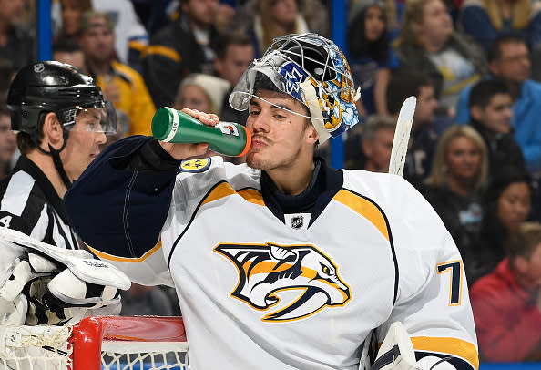 ST. LOUIS, MO - DECEMBER 30: Juuse Saros #74 of the Nashville Predators takes a drink during a game against the St. Louis Blues on December 30, 2016 at Scottrade Center in St. Louis, Missouri. (Photo by Scott Rovak/NHLI via Getty Images)