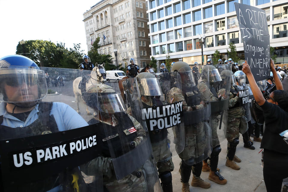 Police clear the area around Lafayette Park and the White House as demonstrators gather to protest the death of George Floyd, Monday, June 1, 2020, in Washington. Floyd died after being restrained by Minneapolis police officers. (AP Photo/Alex Brandon)