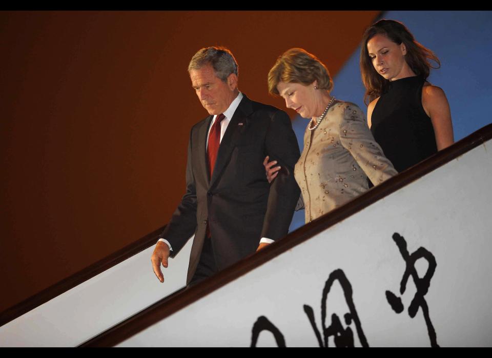 President George W. Bush, First Lady Laura Bush and their daughter Barbara Bush step off Air Force One upon arrival on Aug. 7, 2008 at Beijing Capital International Airport. The U.S. leader, who flew into the Chinese capital from Thailand, made a speech raising 'deep concerns' about China's detention of dissidents and respect for human rights. 