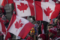 Canada fans cheer as the team plays against the United States during the first half of a World Cup soccer qualifier in Hamilton, Ontario, Sunday, Jan. 30, 2022. (Nathan Denette/The Canadian Press via AP)