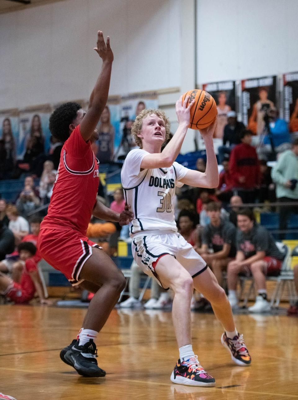 Hutson Rowe (30) looks to shoot during the Crestview vs Gulf Breeze boys basketball game at Gulf Breeze High School on Tuesday, Dec. 20, 2022.