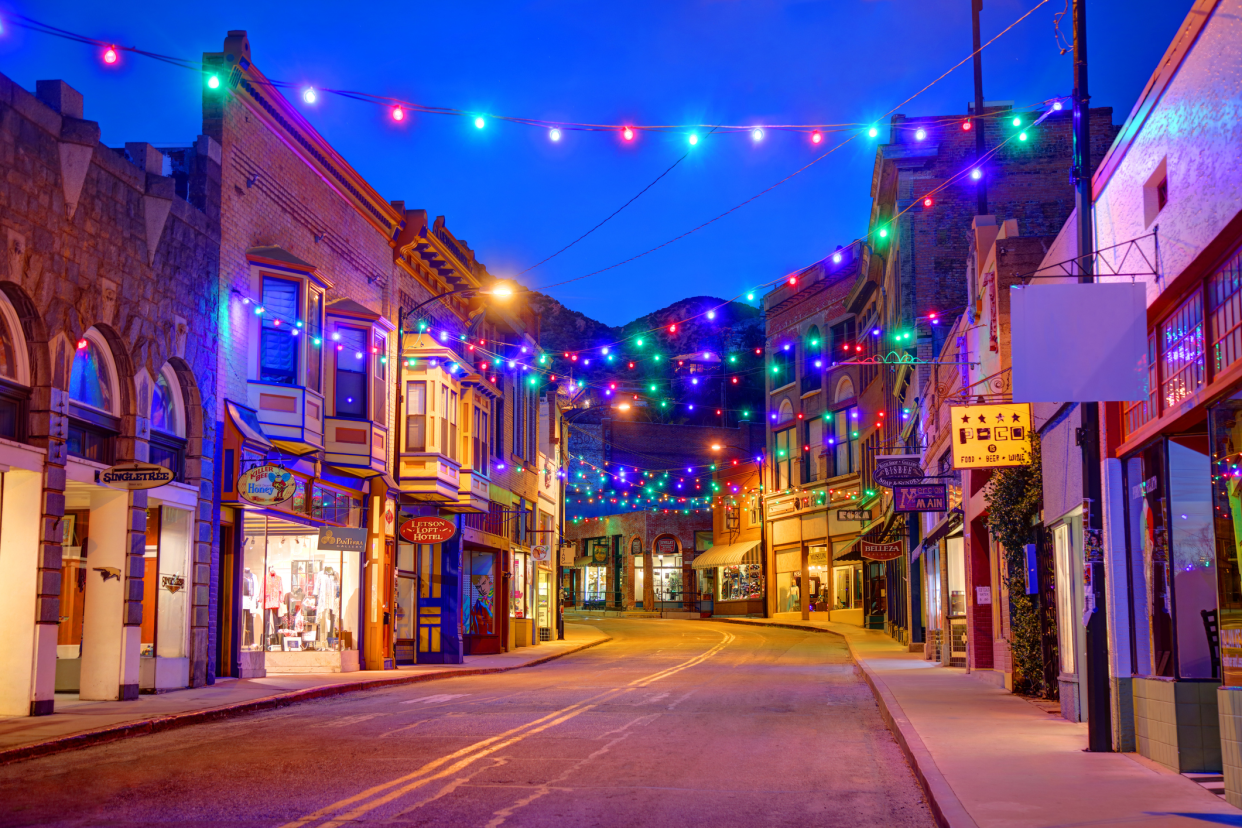 Downtown of Bisbee, Arizona during the holiday season, evening with Christmas lights lining a canopy over the street