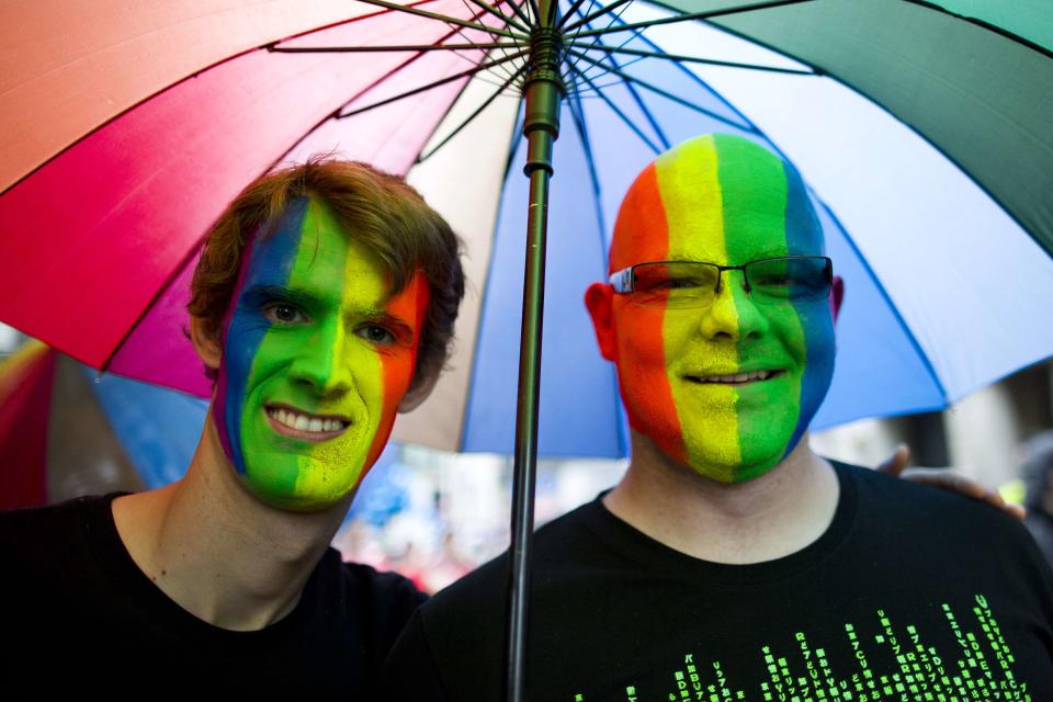 Revelers take part in the annual Pride Parade in London on June 28, 2014.