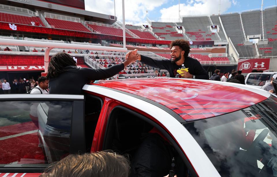 Utah Utes scholarship football players celebrate getting a Dodge truck given to them by the Crimson Collective during an NIL announcement at Rice-Eccles Stadium in Salt Lake City on Wednesday, Oct. 4, 2023. | Jeffrey D. Allred, Deseret News