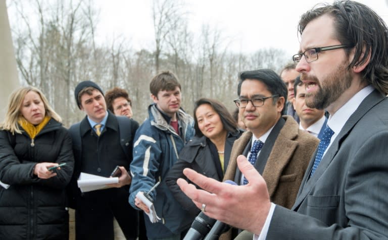 Attorneys for the ACLU, Omar Jadwat (L) and Justin Cox (R) deliver remarks to the media outside US District Court, Southern District of Maryland, March 15, 2017, in Greenbelt, Maryland