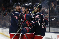 Columbus Blue Jackets' Gregory Hofmann, center, celebrates his goal against the Dallas Stars during the second period of an NHL hockey game Monday, Oct. 25, 2021, in Columbus, Ohio. (AP Photo/Jay LaPrete)