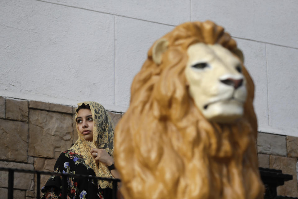 A worshipers stands outside of a La Luz del Mundo church branch before the start of a service Thursday, June 6, 2019, in Los Angeles. California's top prosecutor said Thursday that he believes there are more victims of child sex abuse than those listed in charges against the leader of Mexico-based megachurch La Luz del Mundo and several followers. (AP Photo/Marcio Jose Sanchez)