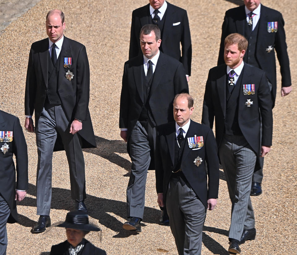 Prince William, left, and Prince Harry, right, walked with their cousin, Peter Phillips, between them during the funeral procession for Prince Philip on April 17, 2021 in Windsor, England.  / Credit: Getty Images