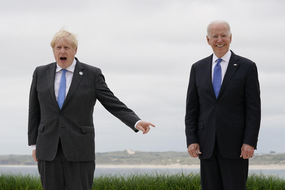 FILE - British Prime Minister Boris Johnson speaks as he and his wife Carrie Johnson pose for photos with President Joe Biden and first lady Jill Biden at the G-7 summit, on June 11, 2021, in Carbis Bay, England. (AP Photo/Patrick Semansky, Pool, File)