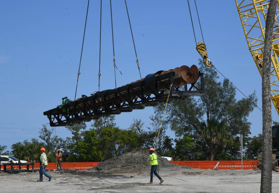 Construction workers with Vecellio & Grogan Inc. work on installing bridge pillars for a new North Causeway Bridge being built in Fort Pierce. The contractor will install 347 concrete pillars, of different sizes, weighing between 45,000 pounds and 94,000. The new bridge will span over the Indian River Lagoon and Old Dixie Highway to meet U.S.1 on the west side, replacing the current drawbridge built in 1963.