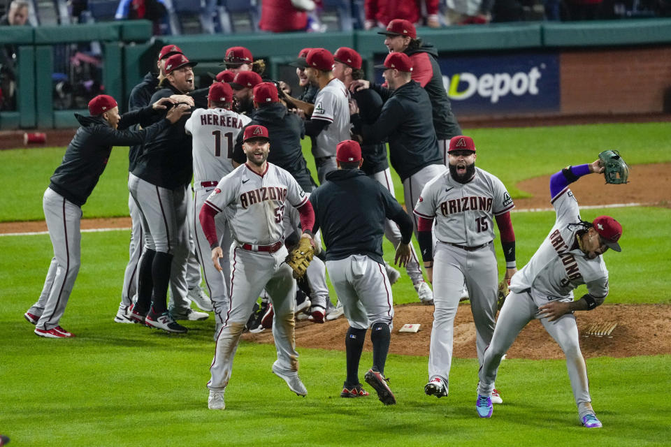 The Arizona Diamondbacks celebrate their win against the Philadelphia Phillies in Game 7 of the baseball NL Championship Series in Philadelphia Tuesday, Oct. 24, 2023. (AP Photo/Matt Rourke)