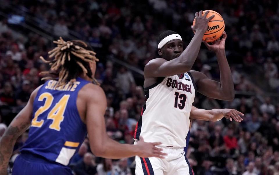 Gonzaga Bulldogs forward Graham Ike (13) drives against McNeese State forward Christian Shumate (24) during the first half of an NCAA Tournament game at Vivint Smart Home Arena-Delta Center on March 21, 2024.