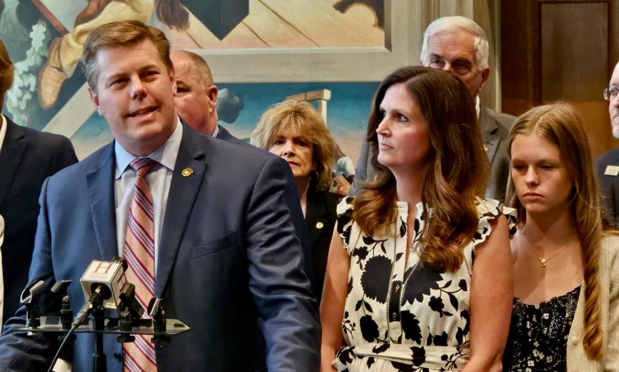 House Speaker Dean Plocher at a news conference Monday claiming victory over an “attempted coup” in the form of a House Ethics Committee investigation. At his side, right, are his wife, Rebecca Plocher, and his daughter.