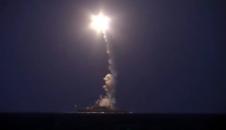 An image grab reportedly shows a Russian warship launching a cruise missile in the Caspian Sea during a strike against Islamic State (IS) group in Syria on October 7, 2015