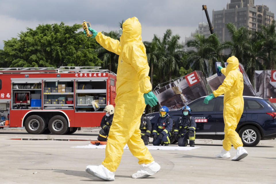 Firefighters in protection suits take part in drills simulating a power plant explosion in New Taipei City, Taiwan on July 14, 2022. While an invasion doesn’t appear imminent, China's recent large-scale military exercises in response to a visit by U.S. House Speaker Nancy Pelosi to Taiwan have made the government in Taipei more aware than ever of the hard power behind Beijing’s rhetoric about bringing the self-ruled island under its control. Experts said that civilian defense and reserve forces have an important deterrent effect, showing a potential aggressor that the risks of invasion are high. (AP Photo/Huizhong Wu)