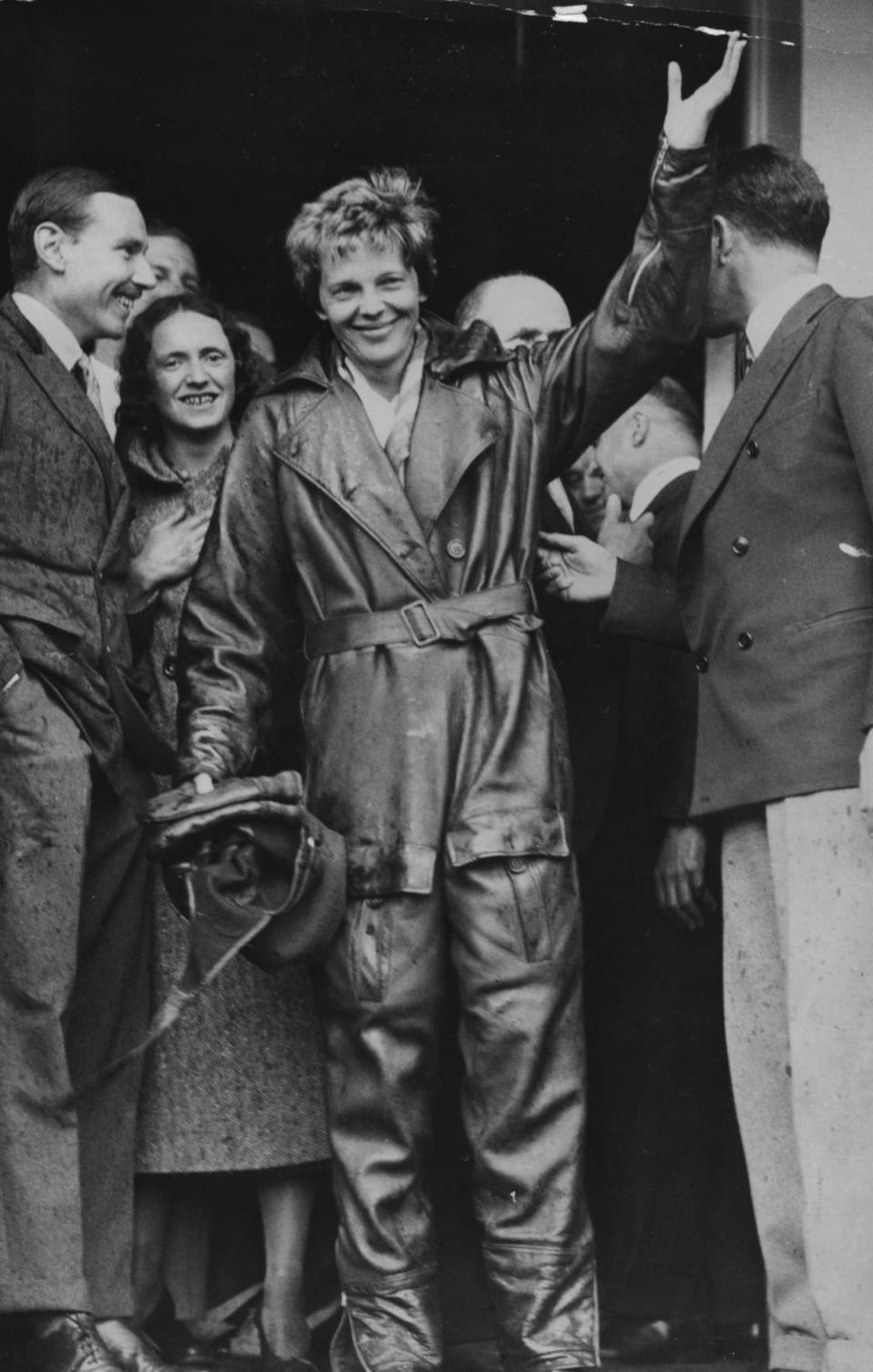 Amelia Earhart waving to the crowds after her solo flight in 1932 (Central Press / Hulton Archive / Getty Images)