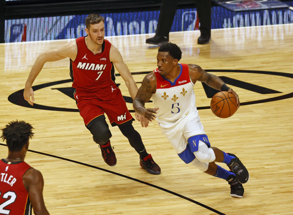 New Orleans Pelicans guard Eric Bledsoe (5) dribbles against Miami Heat guard Goran Dragic (7) during the first half of an NBA basketball game, Friday, Dec. 25, 2020, in Miami. (AP Photo/Joel Auerbach)