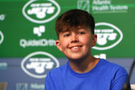 Make-A-Wish recipient Kyle Stickles smiles during an NFL football New York Jets press conference Tuesday, April 25, 2023, in Florham Park, N.J. Stickles will join NFL Commissioner Rodger Goodell on the NFL Draft stage to make the first pick for his favorite team, the New York Jets. (AP Photo/Noah K. Murray)