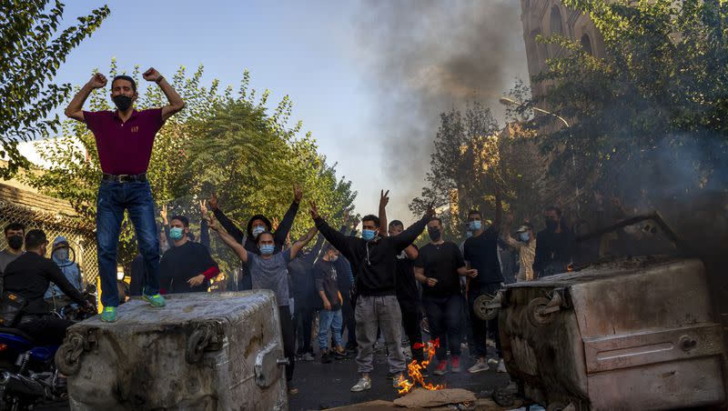 In this photo taken by an individual not employed by The Associated Press and obtained by the AP outside Iran, Iranians protest the death of 22-year-old Mahsa Amini after she was detained by the morality police, in Tehran on Oct. 27, 2022.