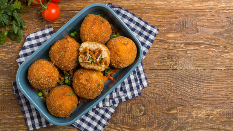 Arancini on wood board