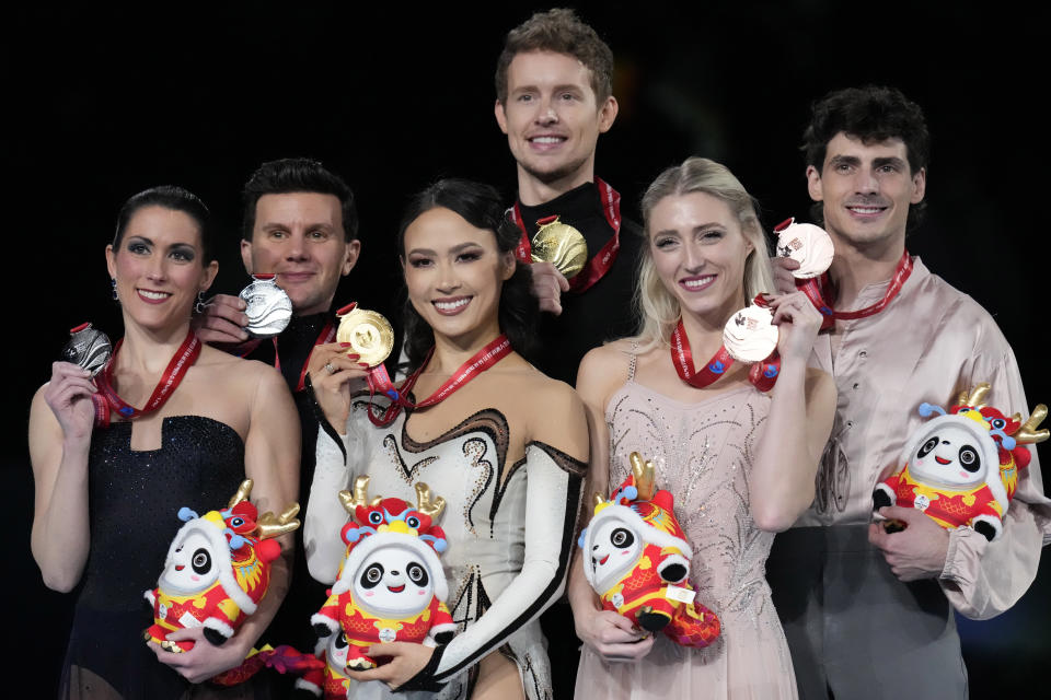 From left, silver medalists Italy's Charlene Guignard and Marco Fabbri, gold medalists United State's Madison Chock and Evan Bates and bronze medalists Canada's Piper Gilles and Paul Poirier pose for photos during the victory ceremony for the Ice Dance Final in the ISU Grand Prix of Figure Skating Final held in Beijing, Saturday, Dec. 9, 2023. (AP Photo/Ng Han Guan)