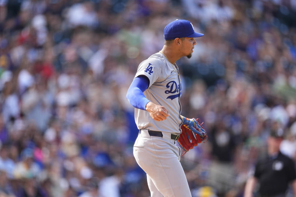 Los Angeles Dodgers relief pitcher Edgardo Henriquez reacts after retiring Colorado Rockies' Aaron Schunk to end a baseball game Sunday, Sept. 29, 2024, in Denver. (AP Photo/David Zalubowski)