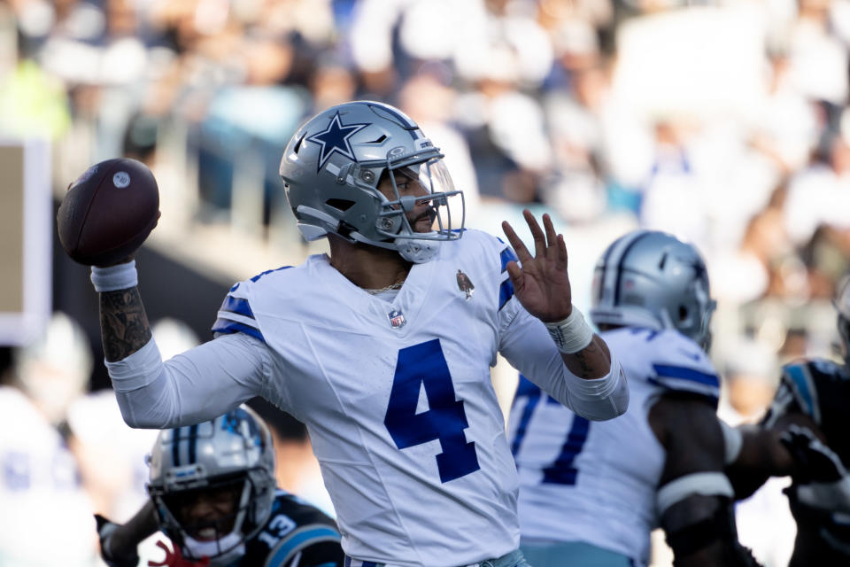 Dallas Cowboys quarterback Dak Prescott (4) looks to pass in the third quarter at Bank of America Stadium. Mandatory Credit: Bob Donnan-USA TODAY Sports