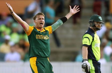 South Africa's Dale Steyne (L) reacts after dismissing Ireland's Paul Stirling for nine runs during their Cricket World Cup match at Manuka Oval in Canberra March 3, 2015. REUTERS/Jason Reed